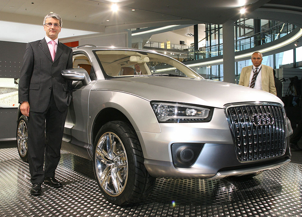 Neckarsulm, GERMANY: Chairman of German car maker Audi Rupert Stadler poses next to an Audi Q7 model prior to an annual general meeting in Neckarsulm 09 May 2007. Stadler said earlier he expected Volkswagen's Audi brand to surpass its 2006 results. AFP PHOTO MICHAEL LATZ     GERMANY OUT  (Photo credit should read MICHAEL LATZ/DDP/AFP via Getty Images)