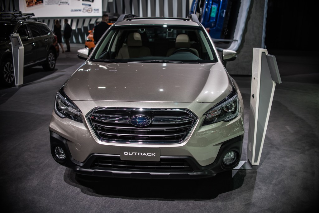 A Subaru Outback on display at an auto show