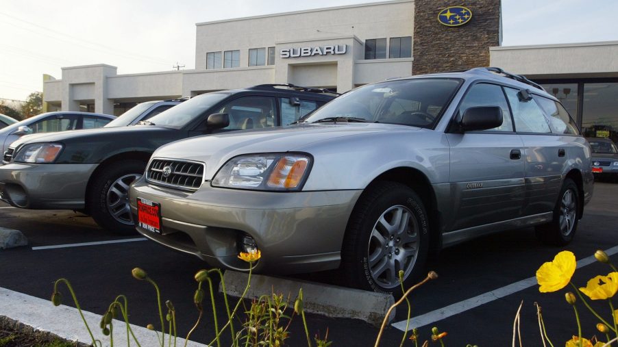 Subaru SUVs on display at a car dealership