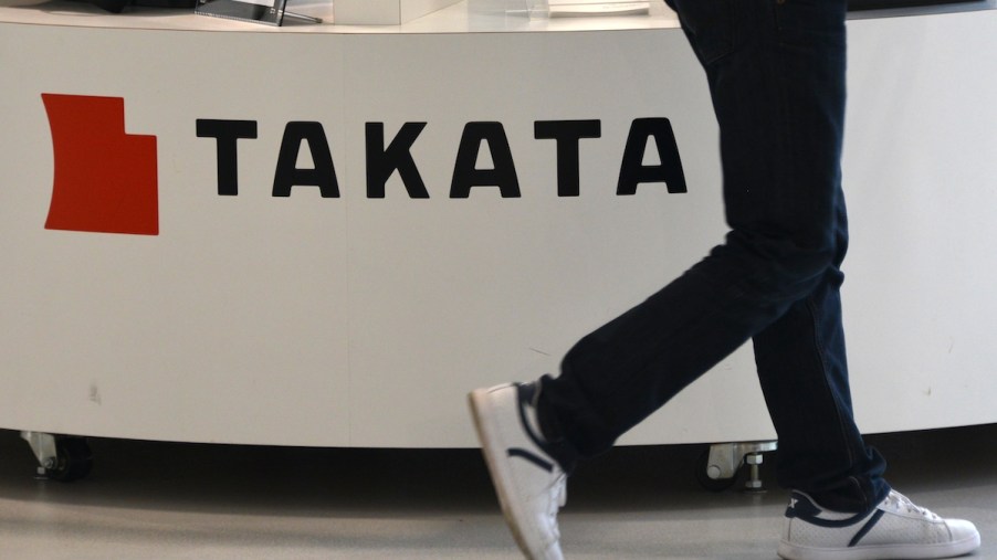 Takata airbags logo with someone walking by