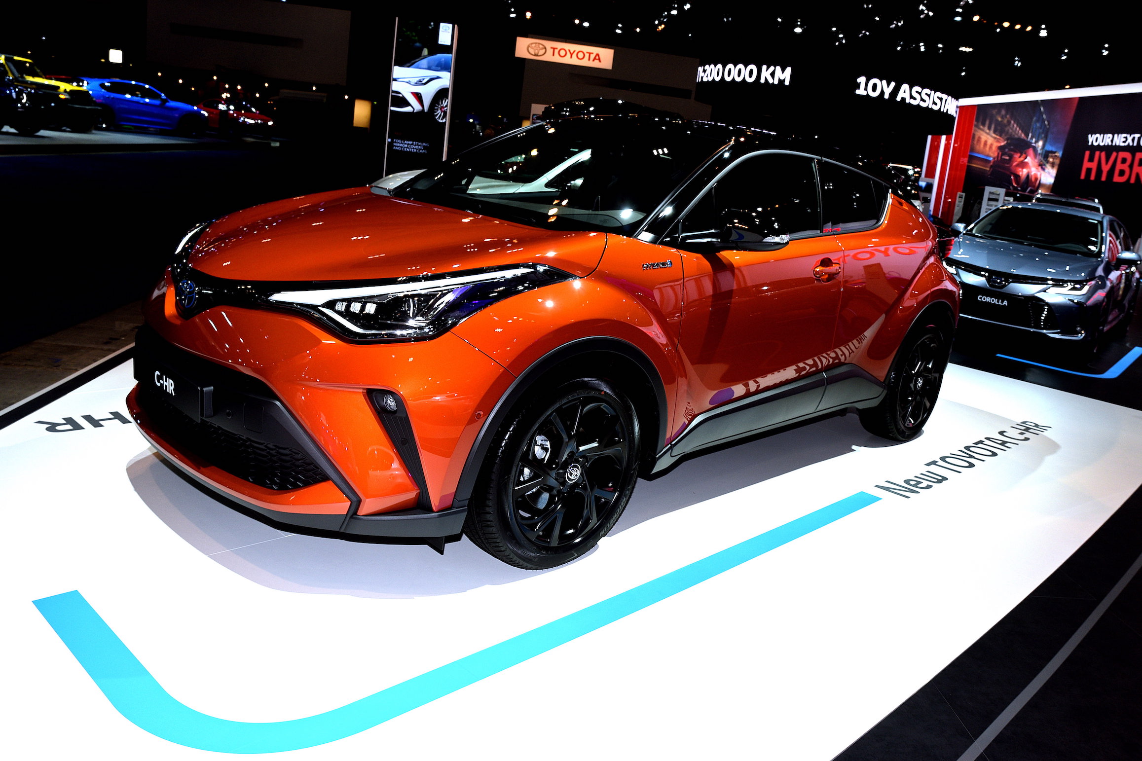 The new Toyota C-HR on display in front of the Toyota Corolla at the Brussels Motor Show