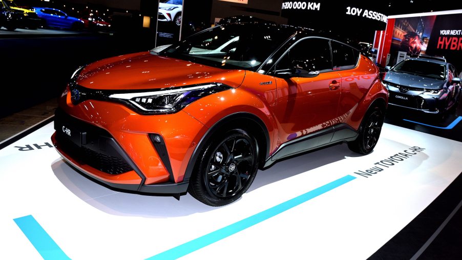 The new Toyota C-HR on display in front of the Toyota Corolla at the Brussels Motor Show