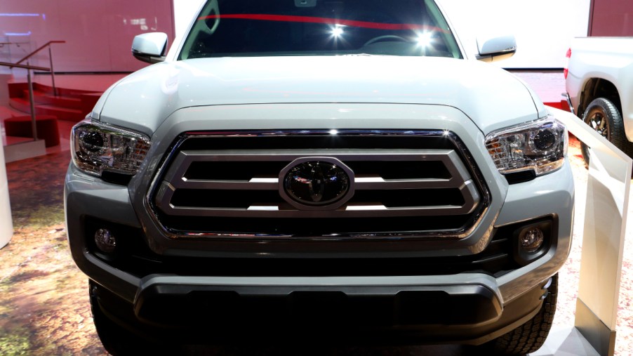 The front grille of a Toyota Tacoma on display at an auto show