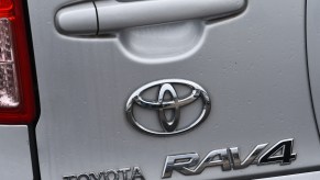 Zoomed-in picture of the Toyota logo on a used Toyota RAV4.