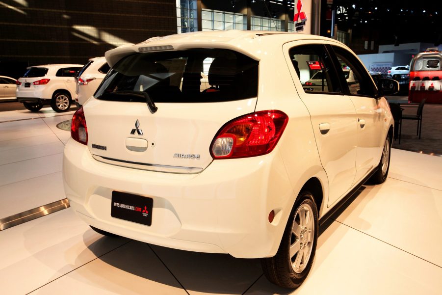 A white Mitsubishi Mirage on display at an auto show