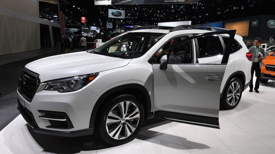 A white Subaru Ascent on display at an auto show