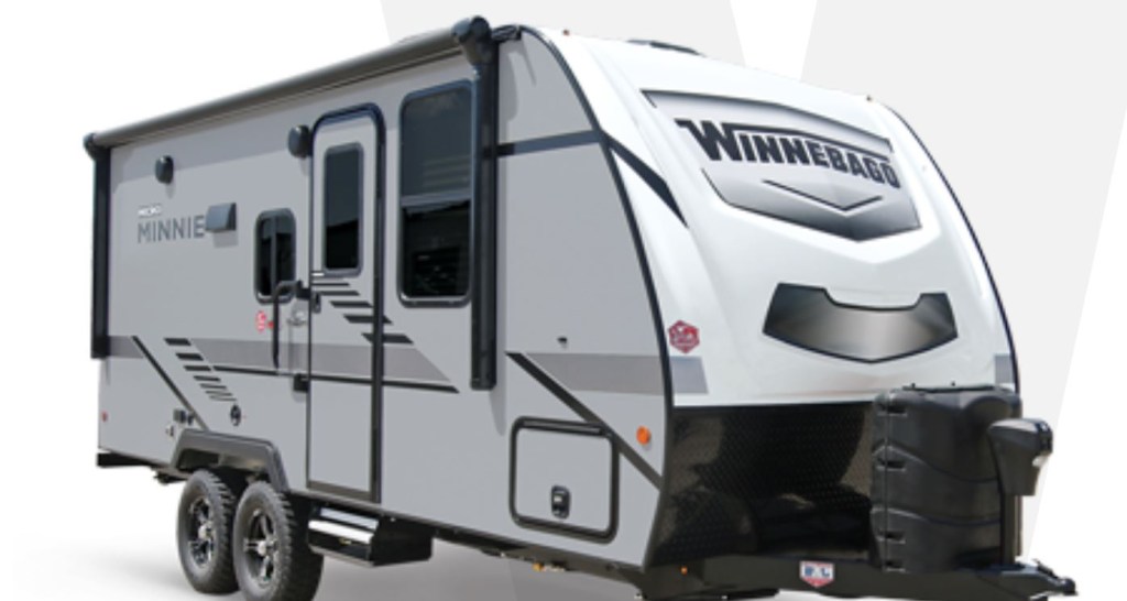 A white travel trailer by Winnebago called the Micro Minni