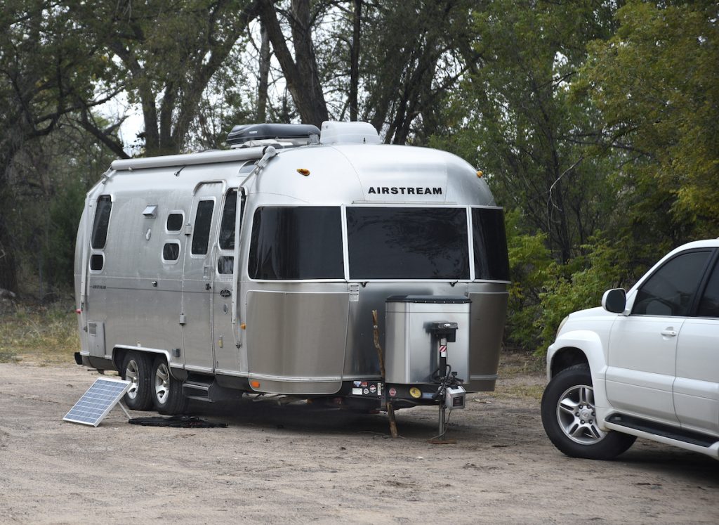 airstream trailer parked with a truck