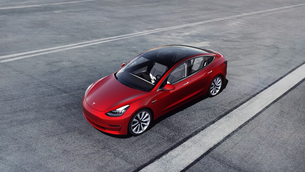 Tesla Model 3 driving on the highway