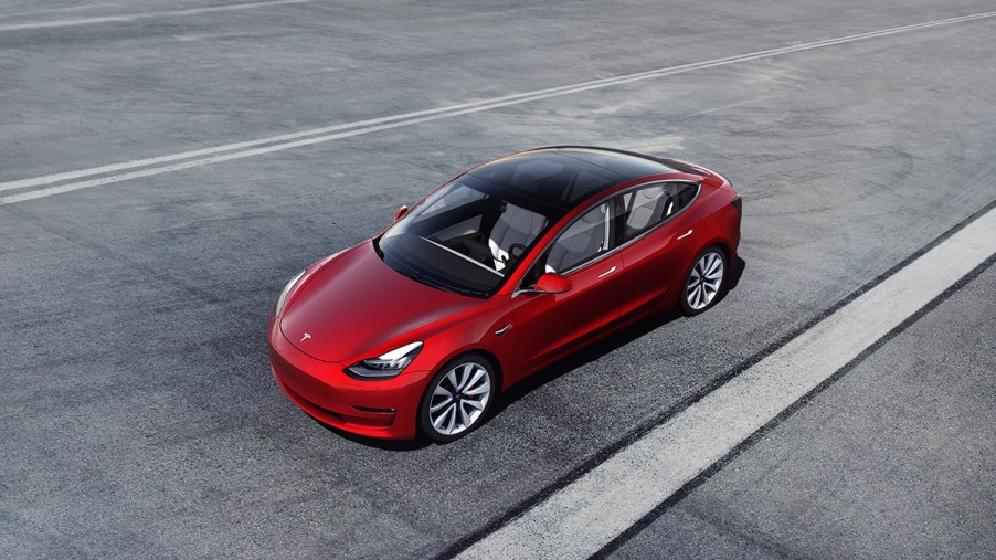 Tesla Model 3 driving on the highway