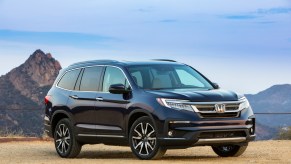 A blue Honda Pilot SUV outdoors.