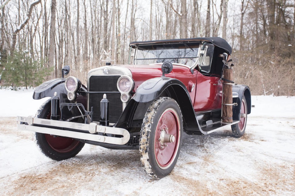A red-and-black 1922 Wills Sainte Claire Model A-68 Rumble-Seat Roadster in the snow