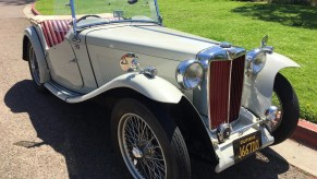 A gray 1949 MG TC EXU parked on the street
