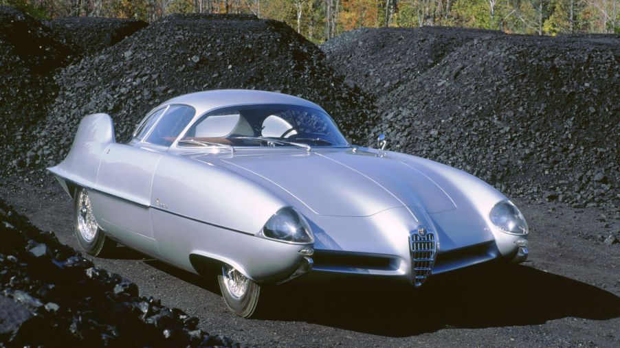 The silver 1955 Alfa Romeo BAT 9 parked amongst coal