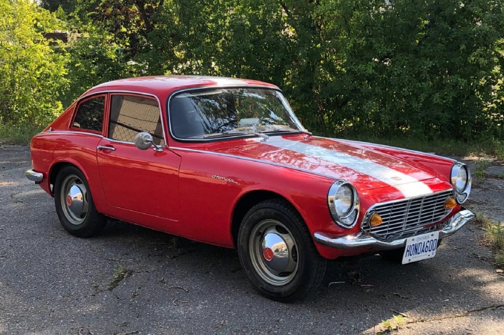 A red 1966 Honda S600 coupe