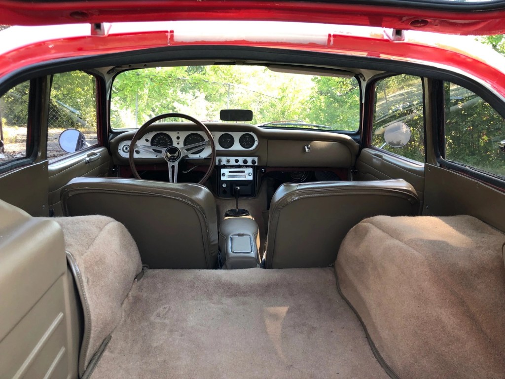 The 1966 Honda S600 coupe's interior seen from the trunk