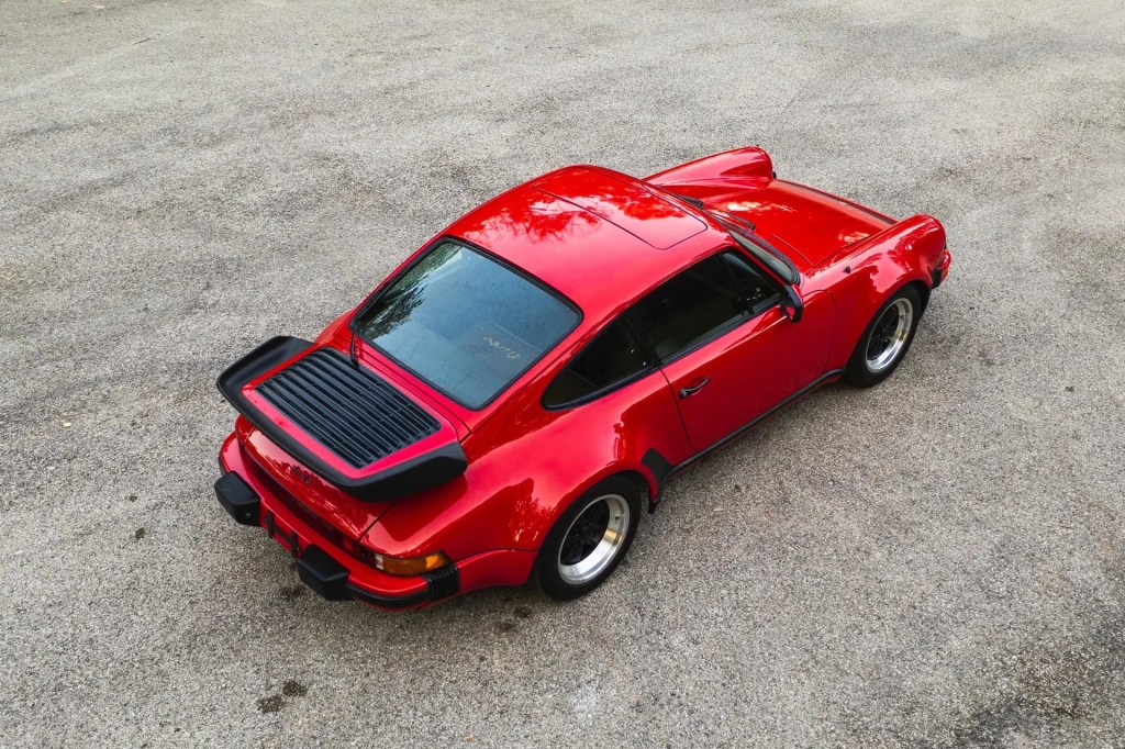 An overhead rear 3/4 view of a red 1978 Porsche 930 911 Turbo