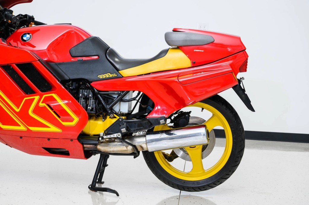 The rear half of a red-and-yellow 1990 BMW K1