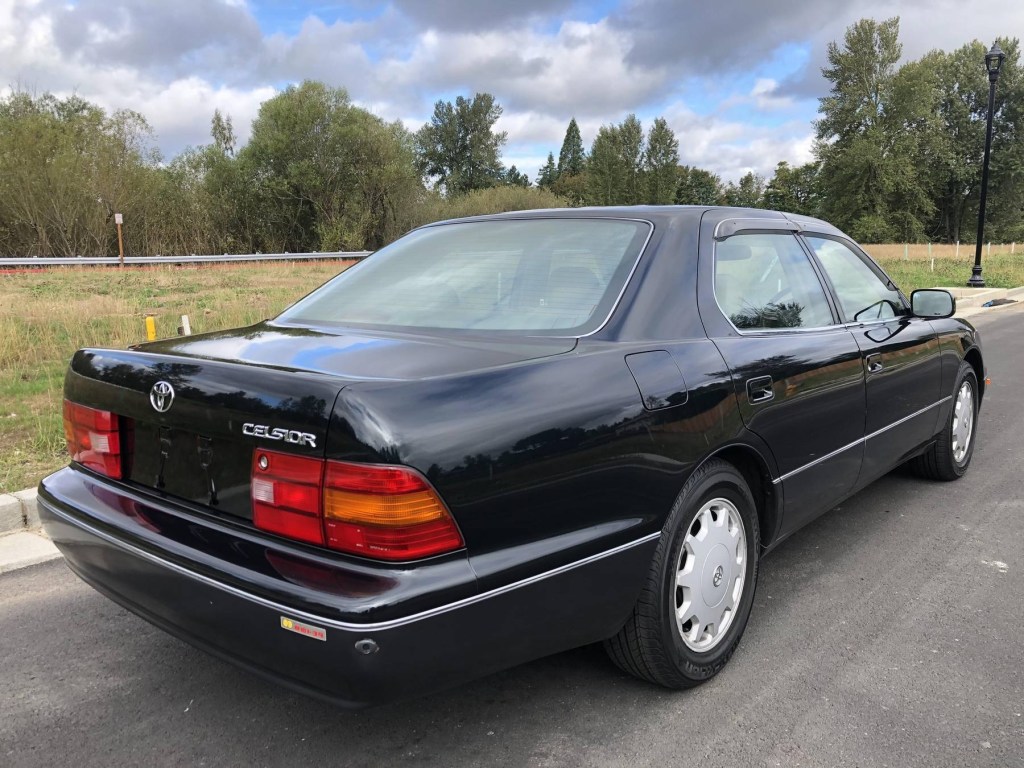 The rear 3/4 view of a black 1995 Toyota Celsior