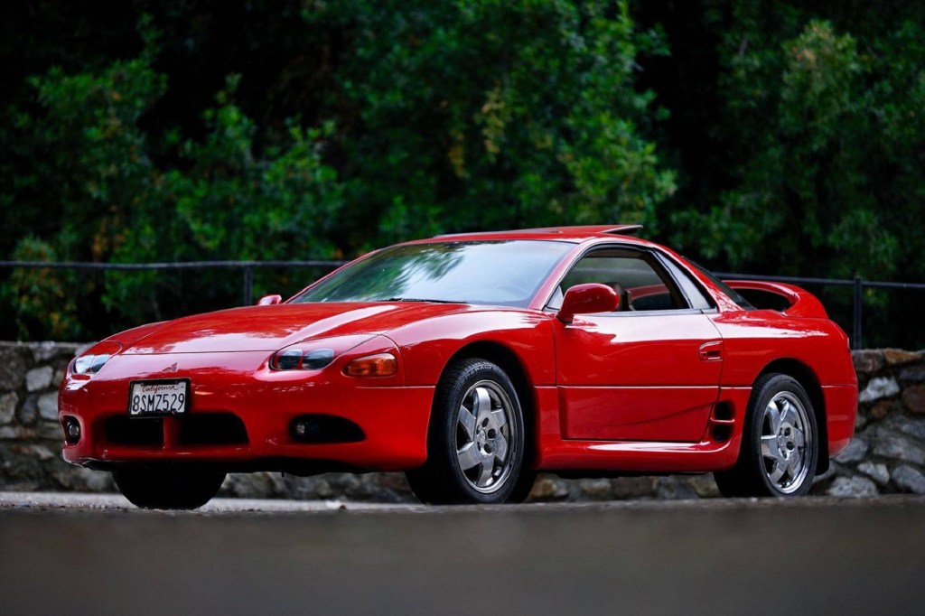 The front 3/4 view of a red 1997 Mitsubishi 3000GT SL