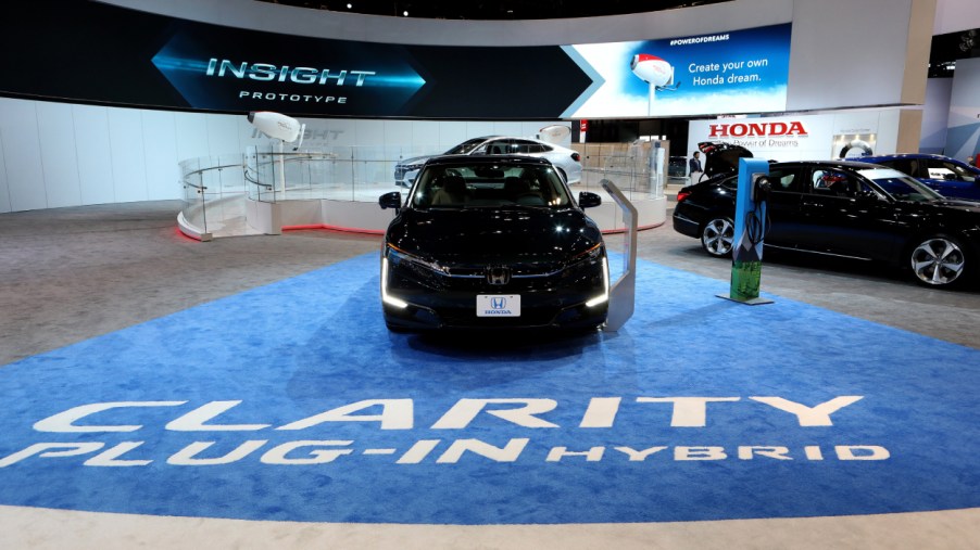 A 2018 Honda Clarity Plug-In Hybrid on display at an auto show