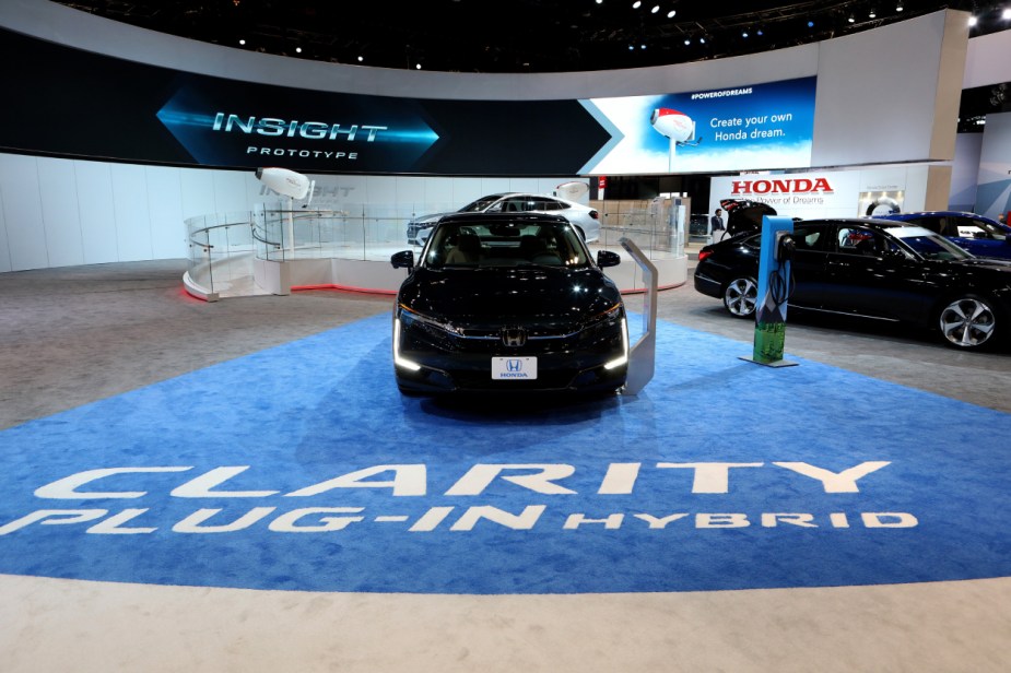 A 2018 Honda Clarity Plug-In Hybrid on display at an auto show