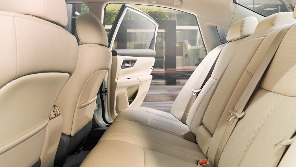 The back row of a 2018 Nissan Altima with beige seats.