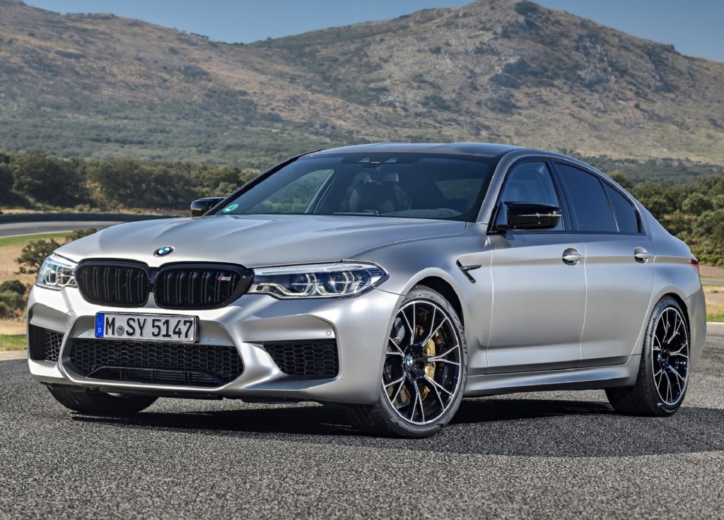 A silver 2019 BMW M5 Competition on a racetrack