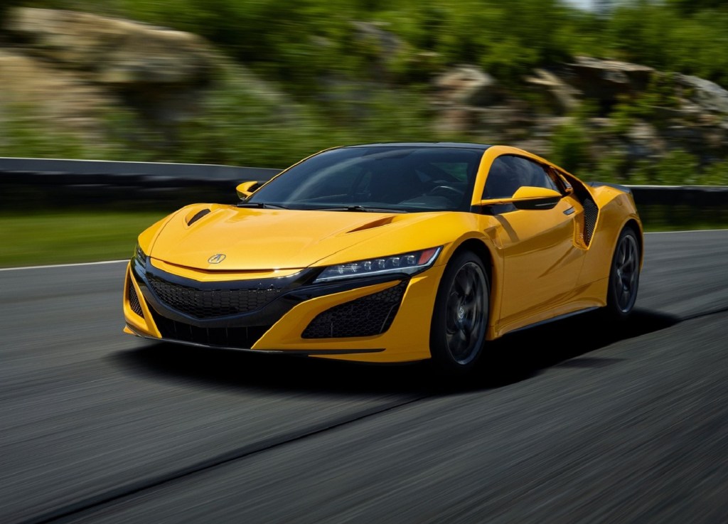 A yellow 2020 Acura NSX on a racetrack