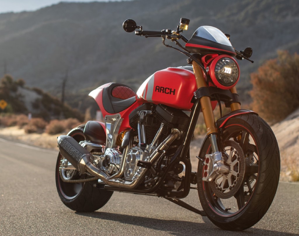 The front 3/4 view of a red 2020 Arch Motorcycle KRGT-1 on a canyon road