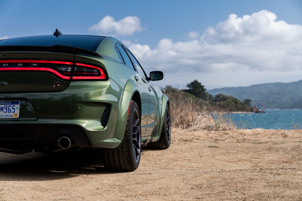 A Green 2020 Dodge Charger sedan facing away toward the water