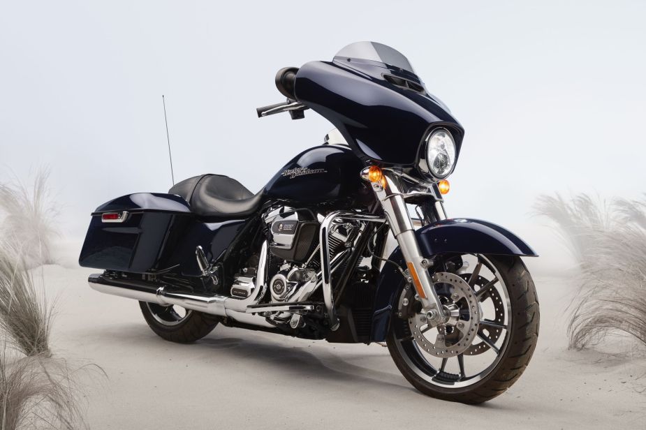 A dark-blue 2020 Harley-Davidson Street Glide parked on a beach