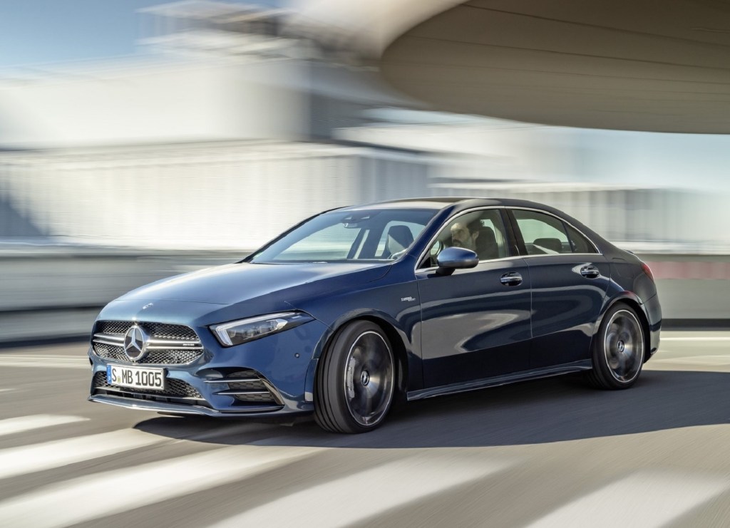 A blue 2020 Mercedes-AMG A35 drives on a city road