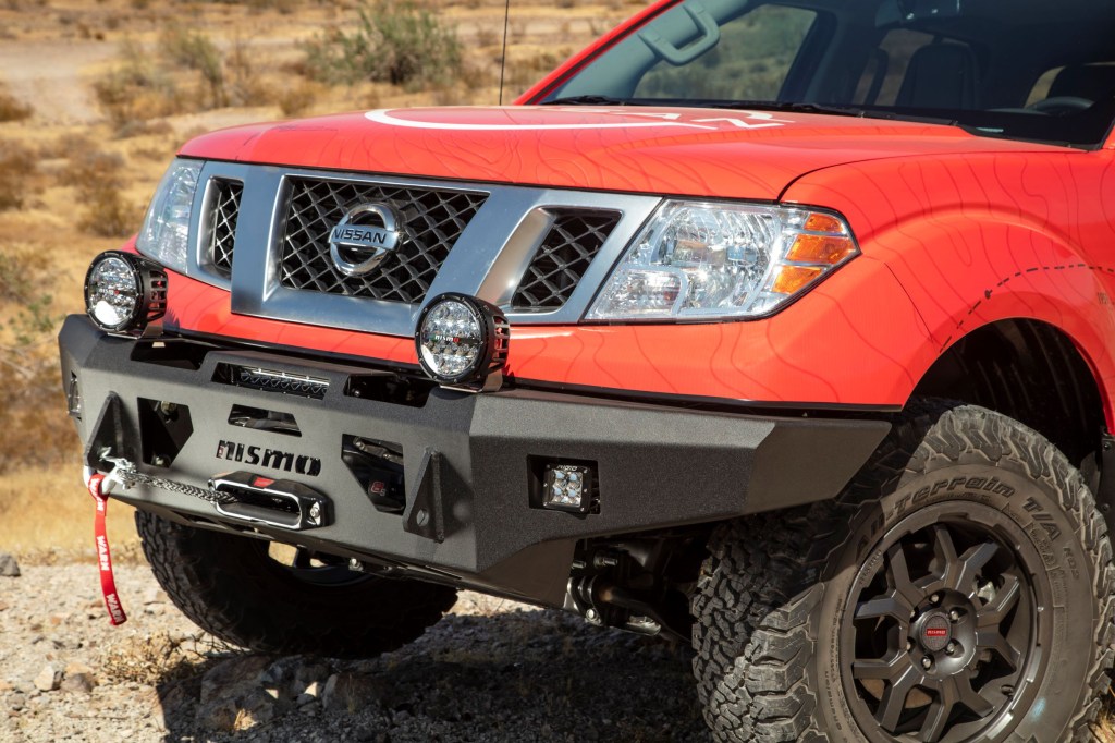 A red 2020 Nissan Frontier with a black powder-coated Nismo winch-ready bumper