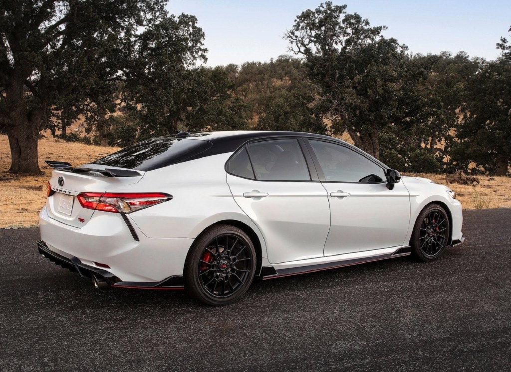 The rear 3/4 view of a white 2020 Toyota Camry TRD