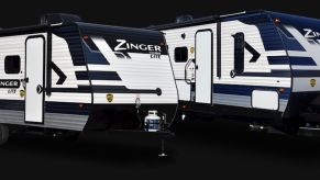 Two Zinger RV travel trailers side-by-side