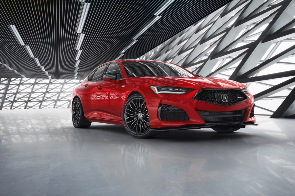 The 2021 Acura TLX Type S on display in front of a futuristic gray and silver background