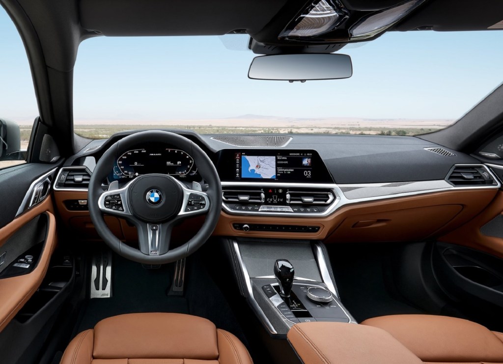 The 2021 BMW M440i xDrive's front seats and dashboard