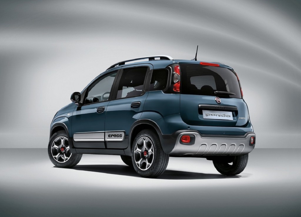 The rear 3/4 view of a blue 2021 Fiat Panda Cross