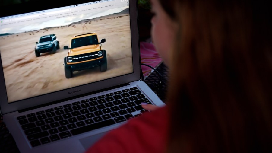 A person watching the premiere of the 2021 Ford Bronco