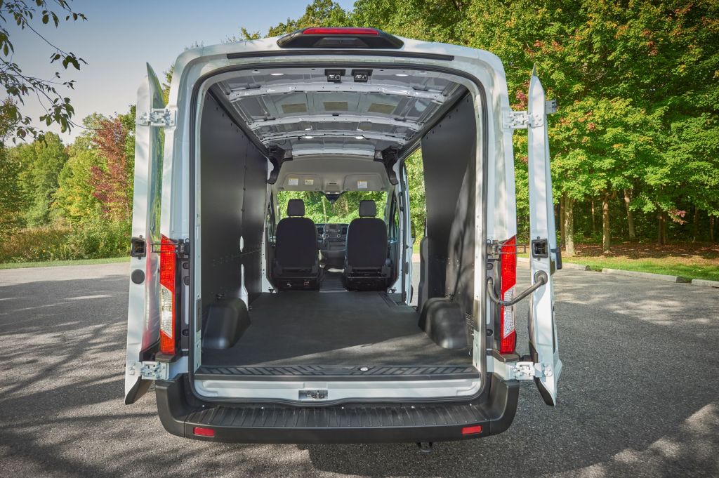 The 2021 Ford Transit's cargo area and interior seen from the open rear doors
