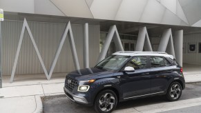 The 2021 Hyundai Venue parked on display in front of a building