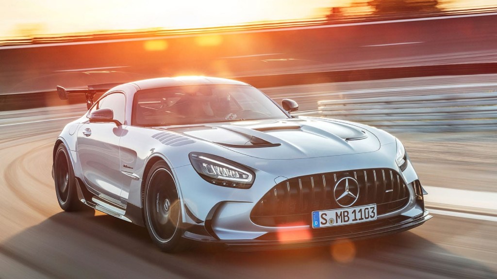 A silver 2021 Mercedes-AMG GT Black Series goes around a racetrack corner