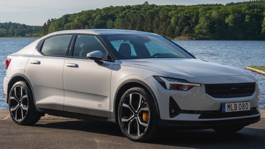 A white 2021 Polestar 2 in front of a body of water