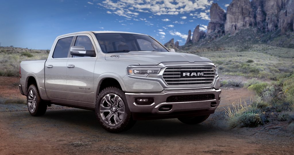 A press image of a silver 2021 Ram 1500 Limited Longhorn 10th Anniversary Edition in a southwestern outdoors scene