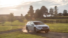 2021 Subaru Crosstrek driving through a field