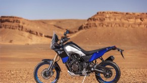 A blue 2021 Yamaha Ténéré 700 by the desert landscape