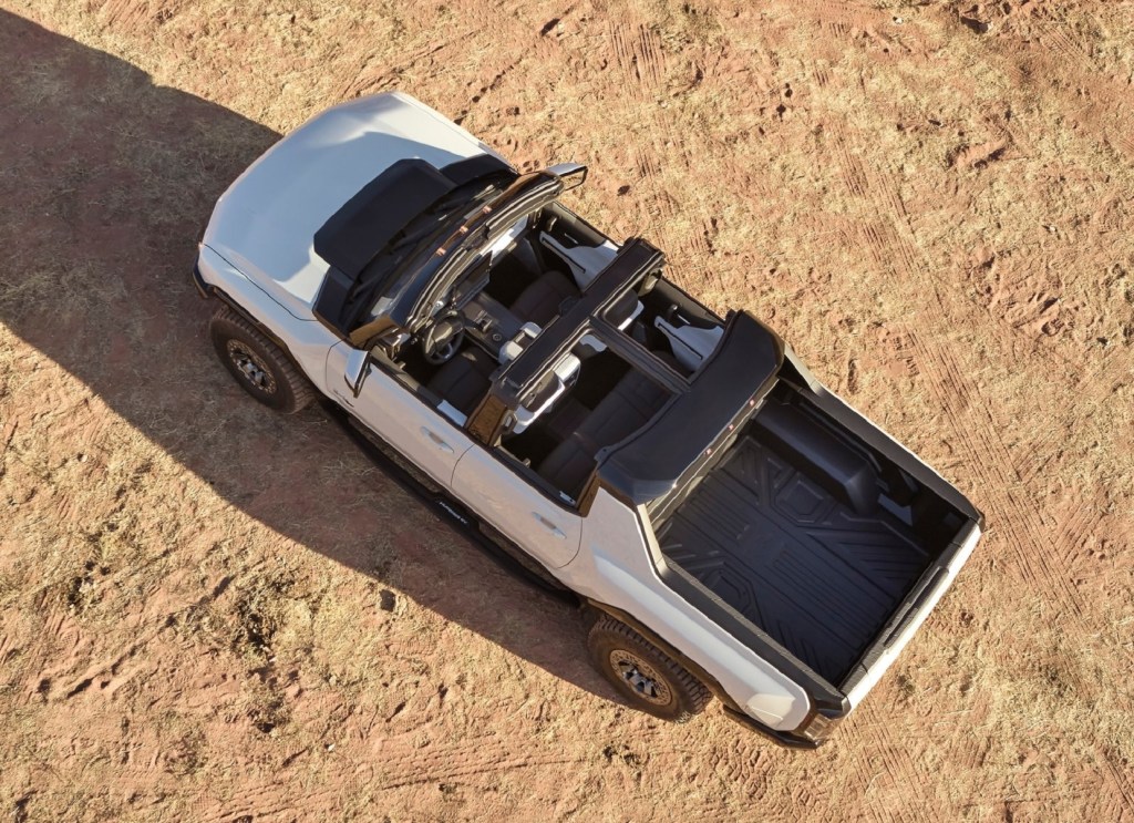 An overhead view of a white 2022 GMC Hummer EV with its roof removed