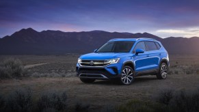 Press image of a blue 2022 Volkswagen Taos in the desert