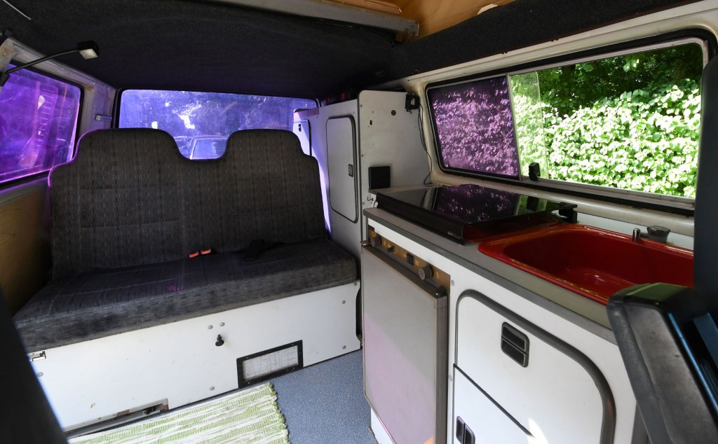 The sink and fridge in a converted Volkswagen T3 camper van